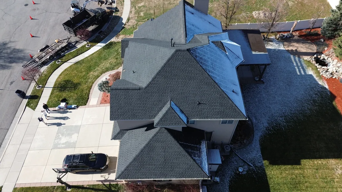 Roof geometry showing snow drifting around dormers and valley transitions