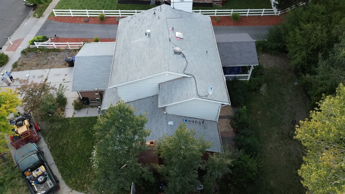 Roof deck being repaired and patched after swamp cooler curb removal