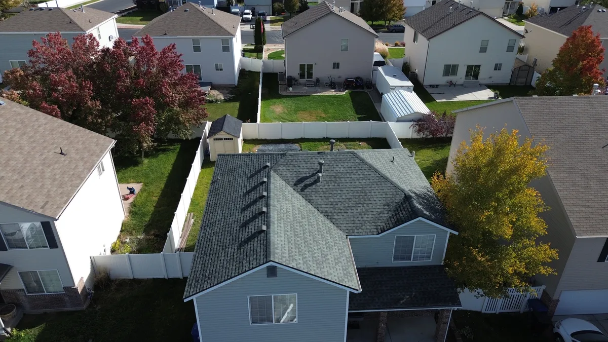 Vertical standing seam metal roof panels on a modern Utah home