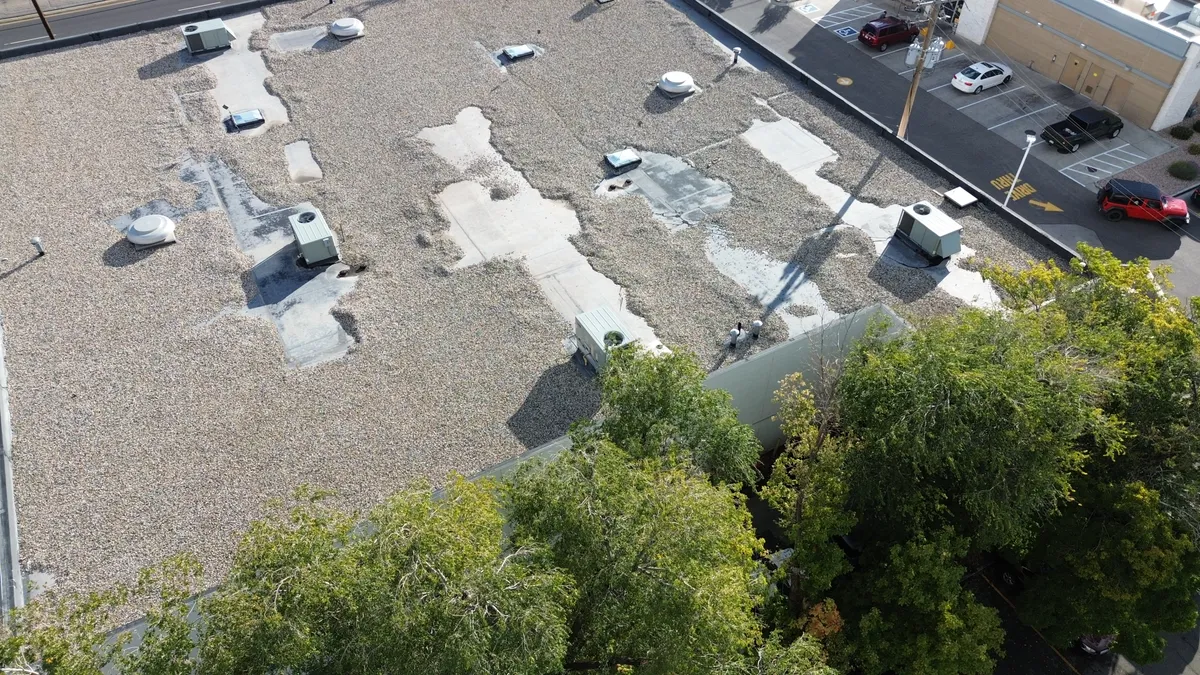 Sky Ridge technician performing a pliability test on older asphalt shingles